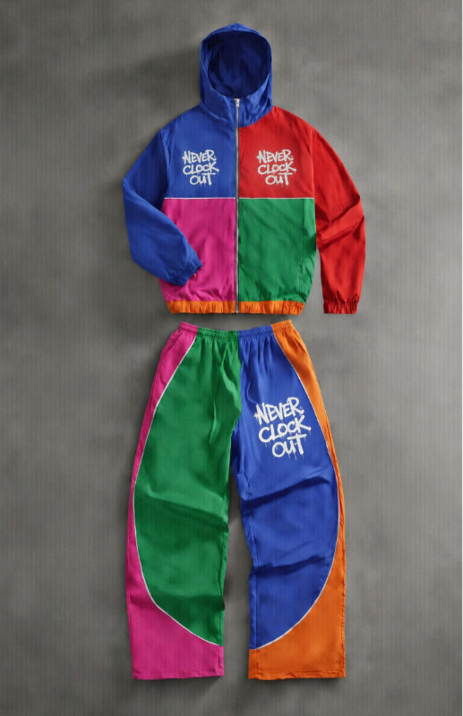 Colorful tracksuit with 'Never Clock Out' text on a gray background